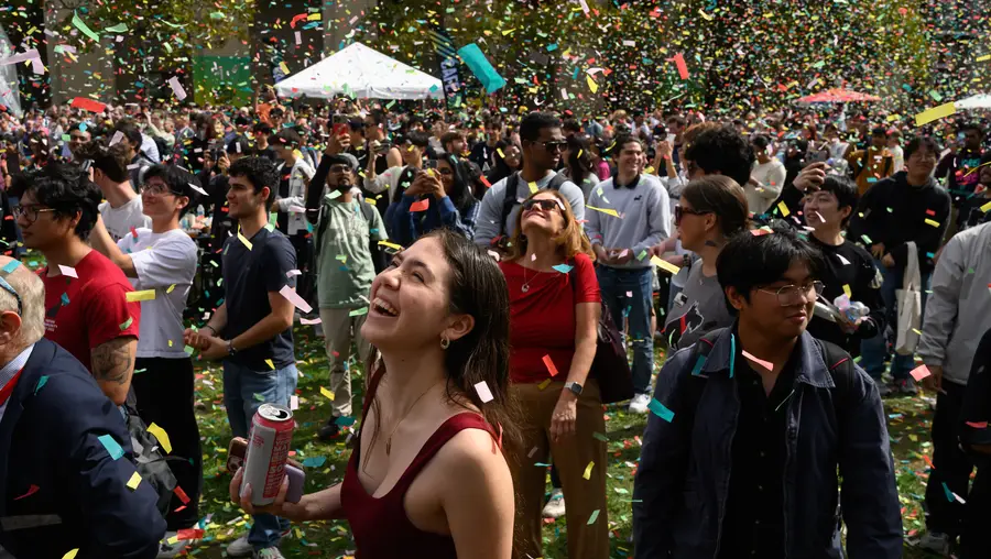 Students enjoy a rain of confetti
