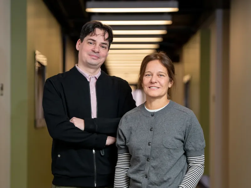 Two people, Barnabás Póczos and Tiziana Di Matteo, standing next to each other