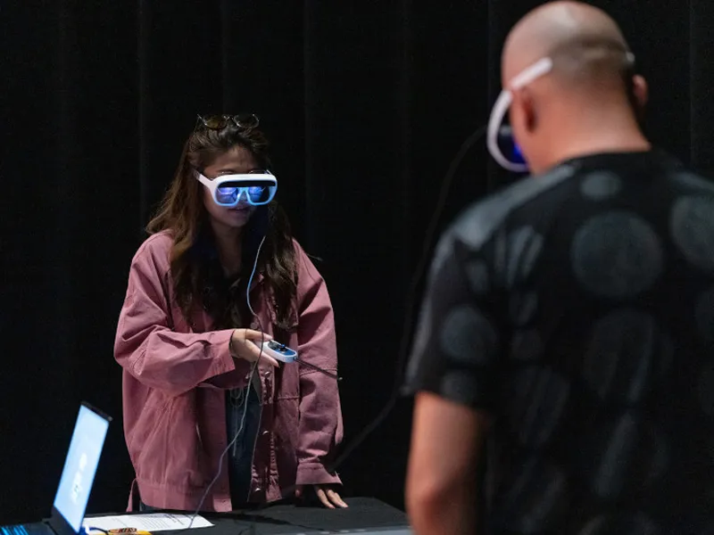 CMU students work with AI technology and virtual glasses.