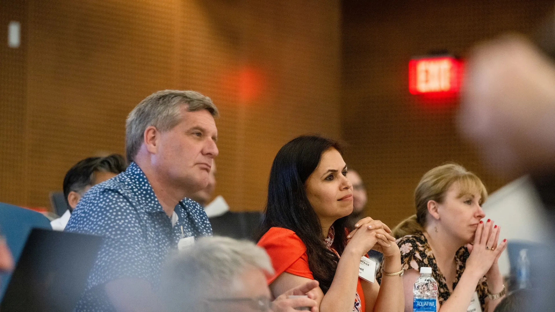People sitting in a classroom listening to a lecture