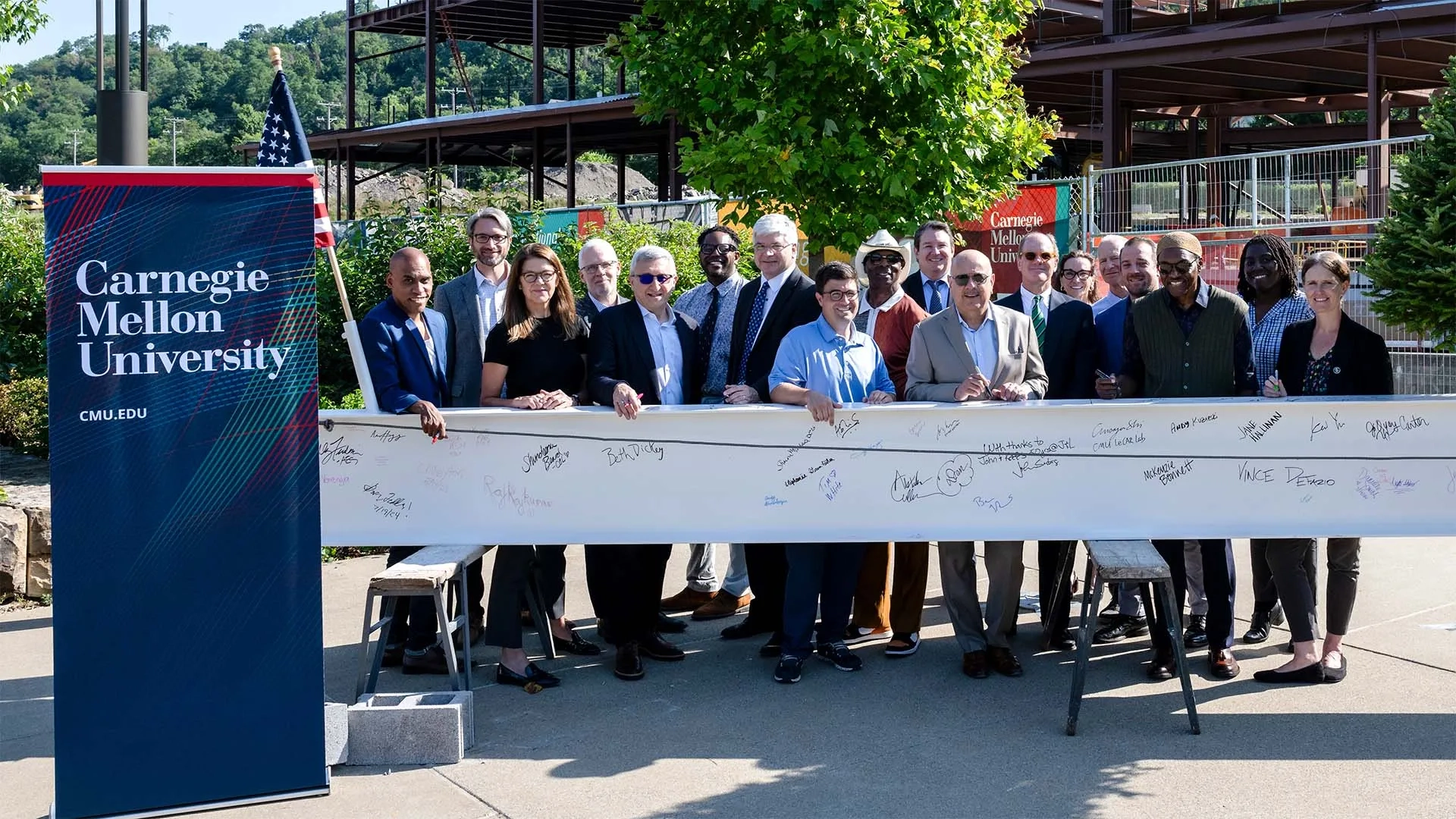 Signing the I-beam for the Robotics Innovation Center at Hazelwood Green.
