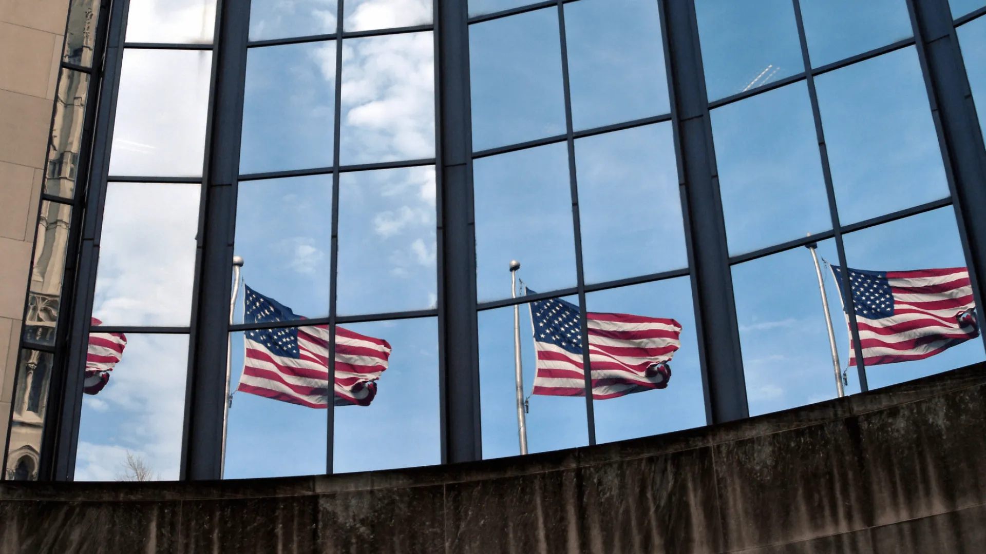 Reflections of the American flag in windows