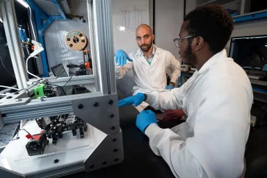 Two students working in a research lab