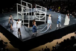 Models walk around the Lunar Gala runway, which is shaped like a diamond